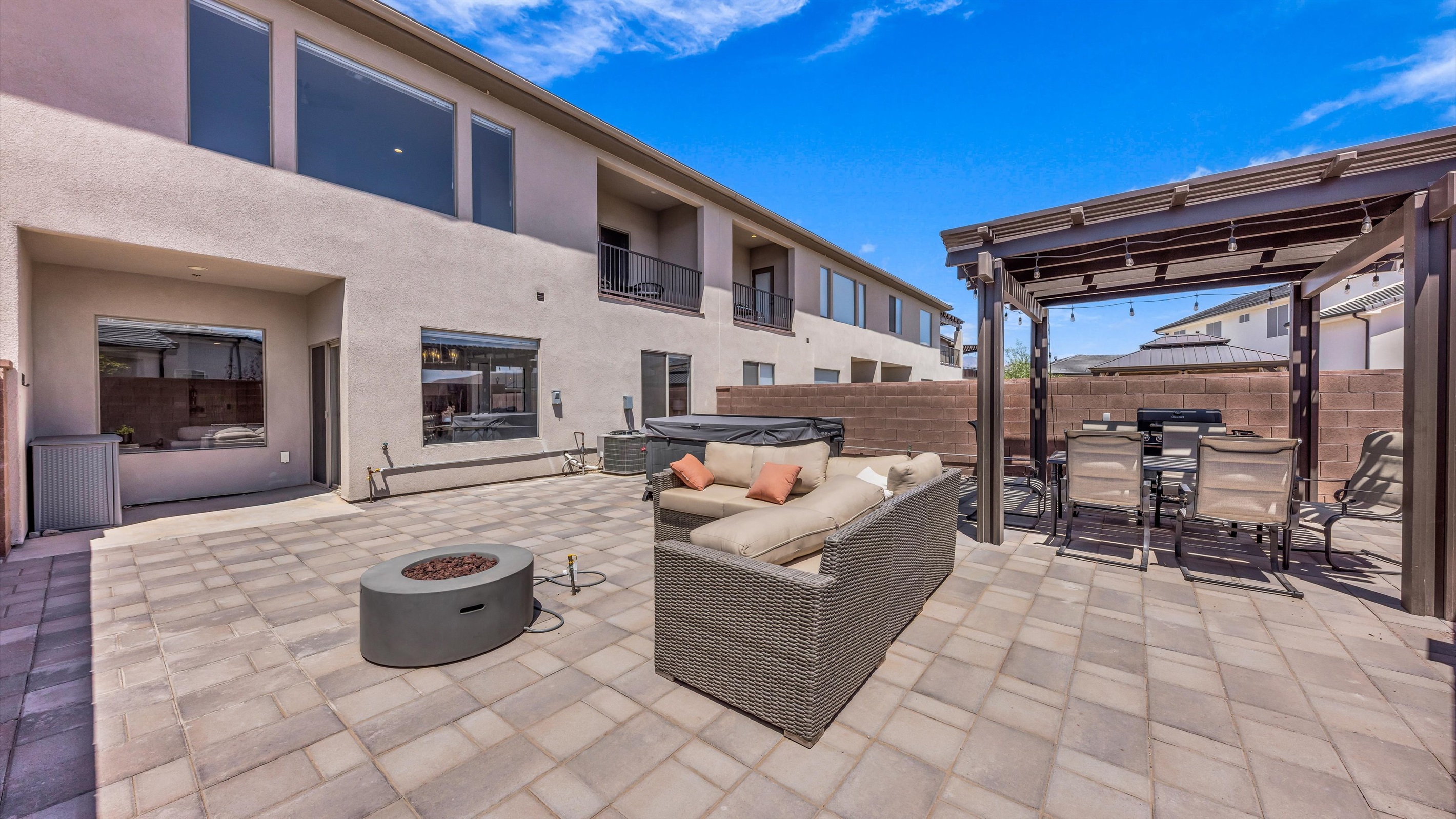 Spacious Paver Courtyard Seamlessly Connected to Home