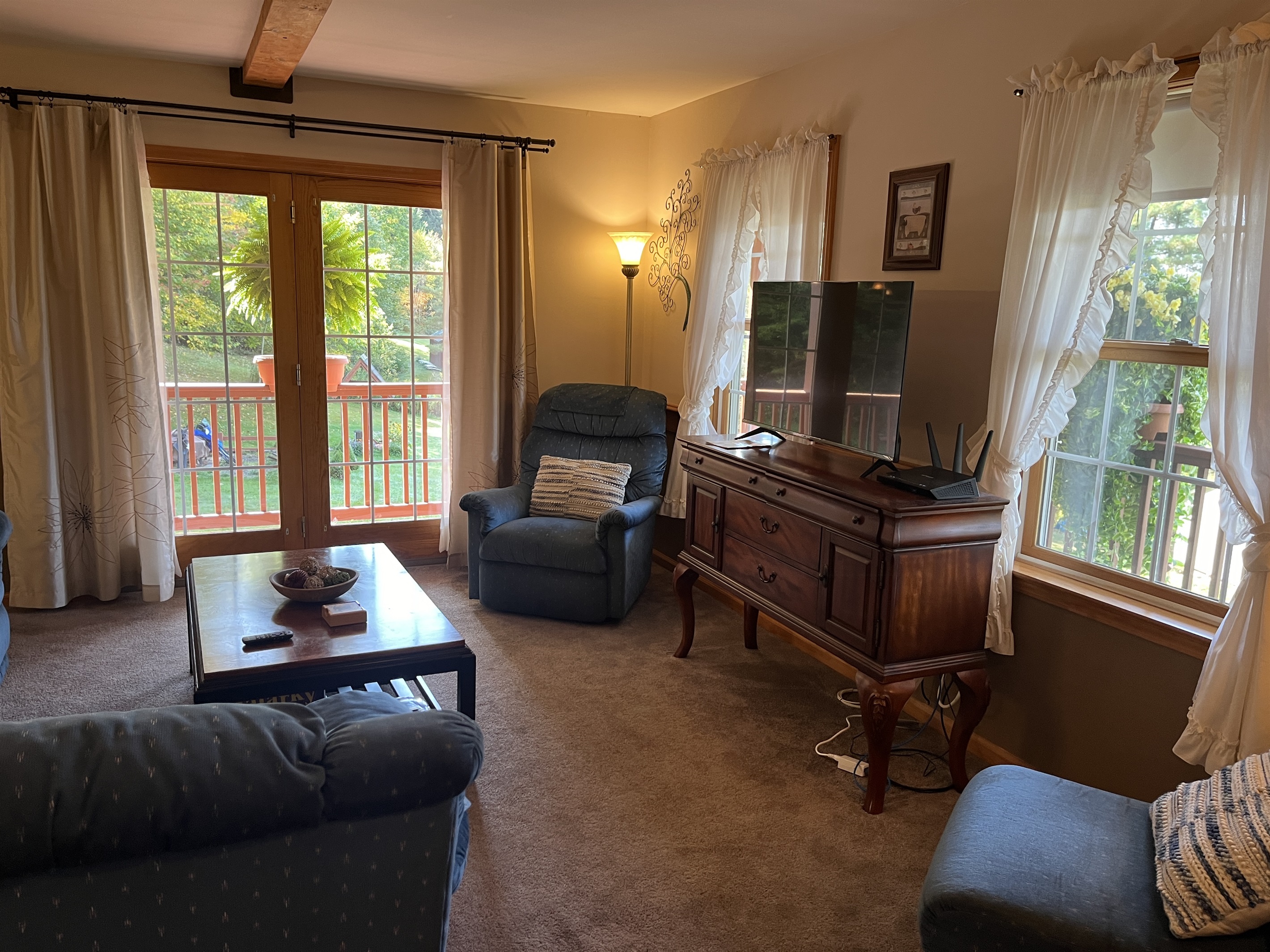 Living room with sliders on to wraparound porch