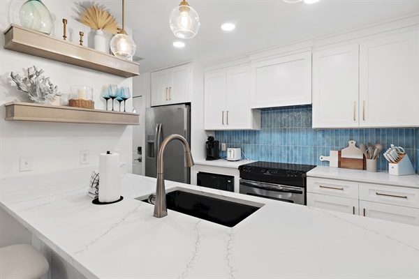 Fully Equipped Modern Kitchen: Prepare your favorite meals in our brand new fully remodeled and fully equipped kitchen with stainless steel appliances and ample counter space.