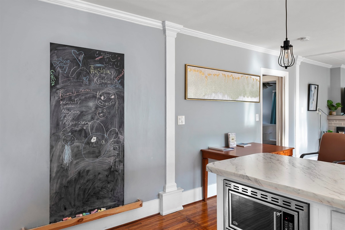 A playful chalkboard wall adds a personal touch—leave a note, a doodle, or your plans for the day