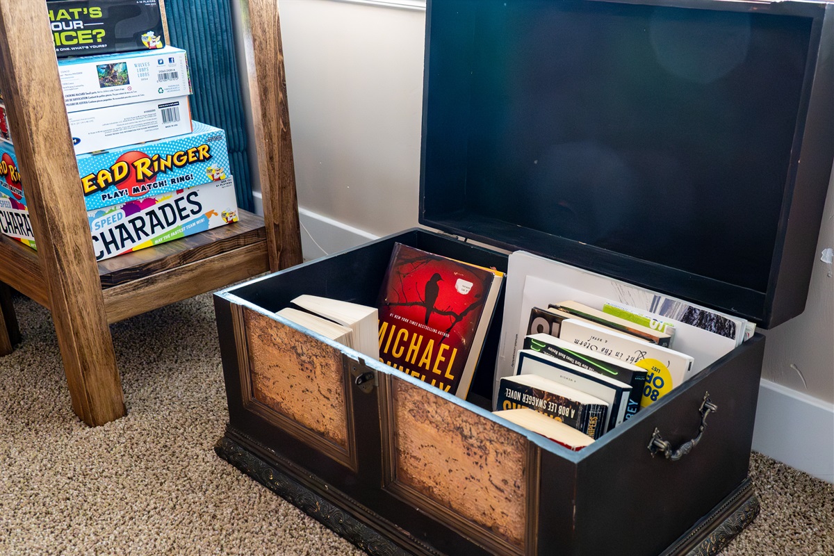 Storage chest stocked with books.