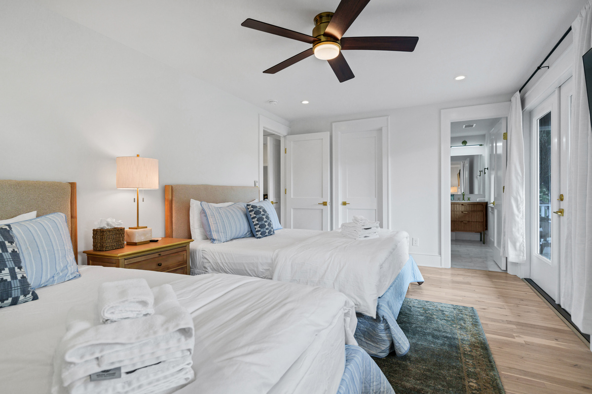 Guest Bedroom 2 on 1st Living Floor with Private Bath and Private Deck!  Features Two Queen Beds.