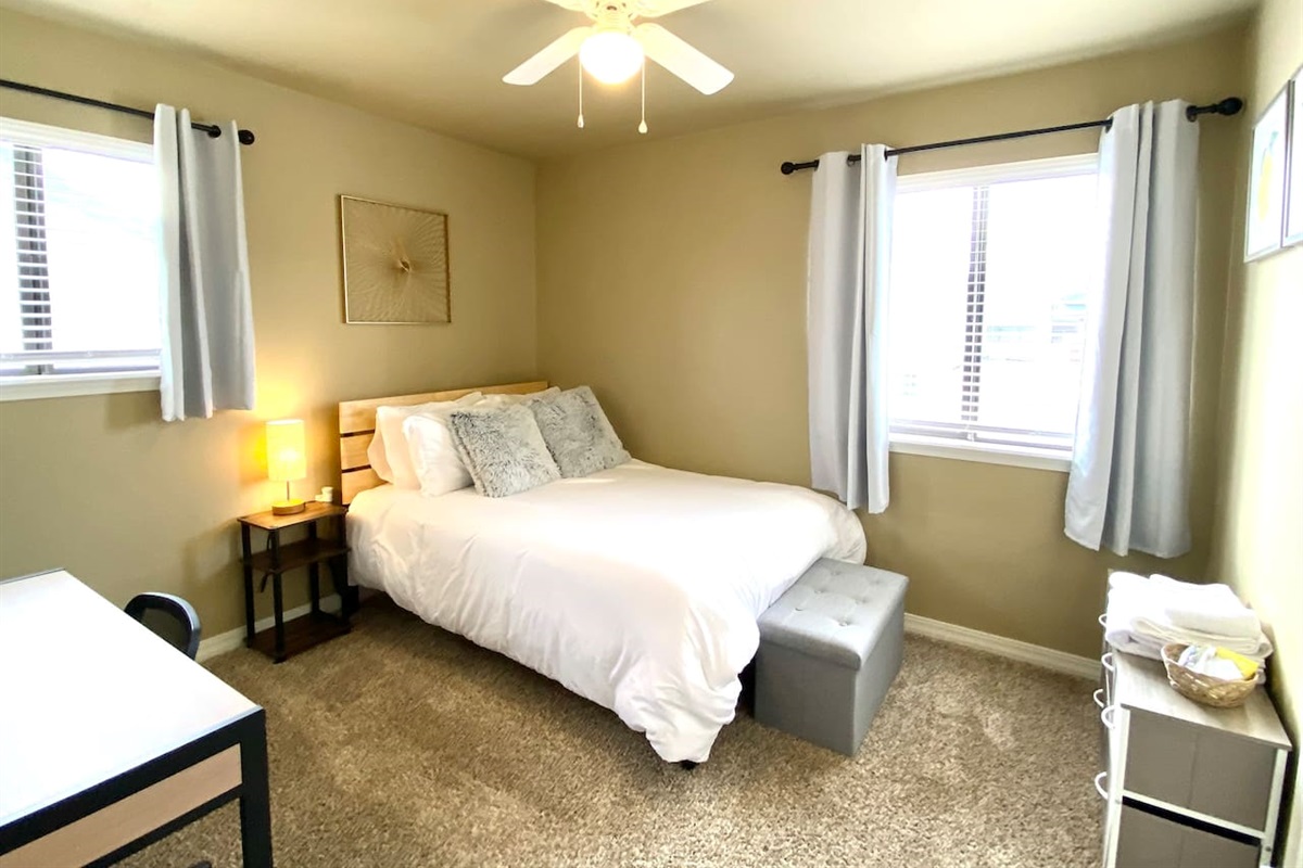 Bedroom with double bed and desk
