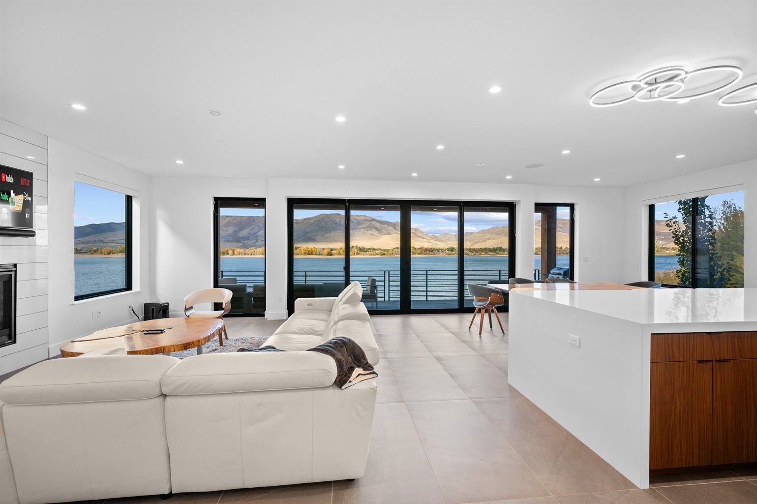 Expansive living room showcasing breathtaking Pineview Reservoir views.