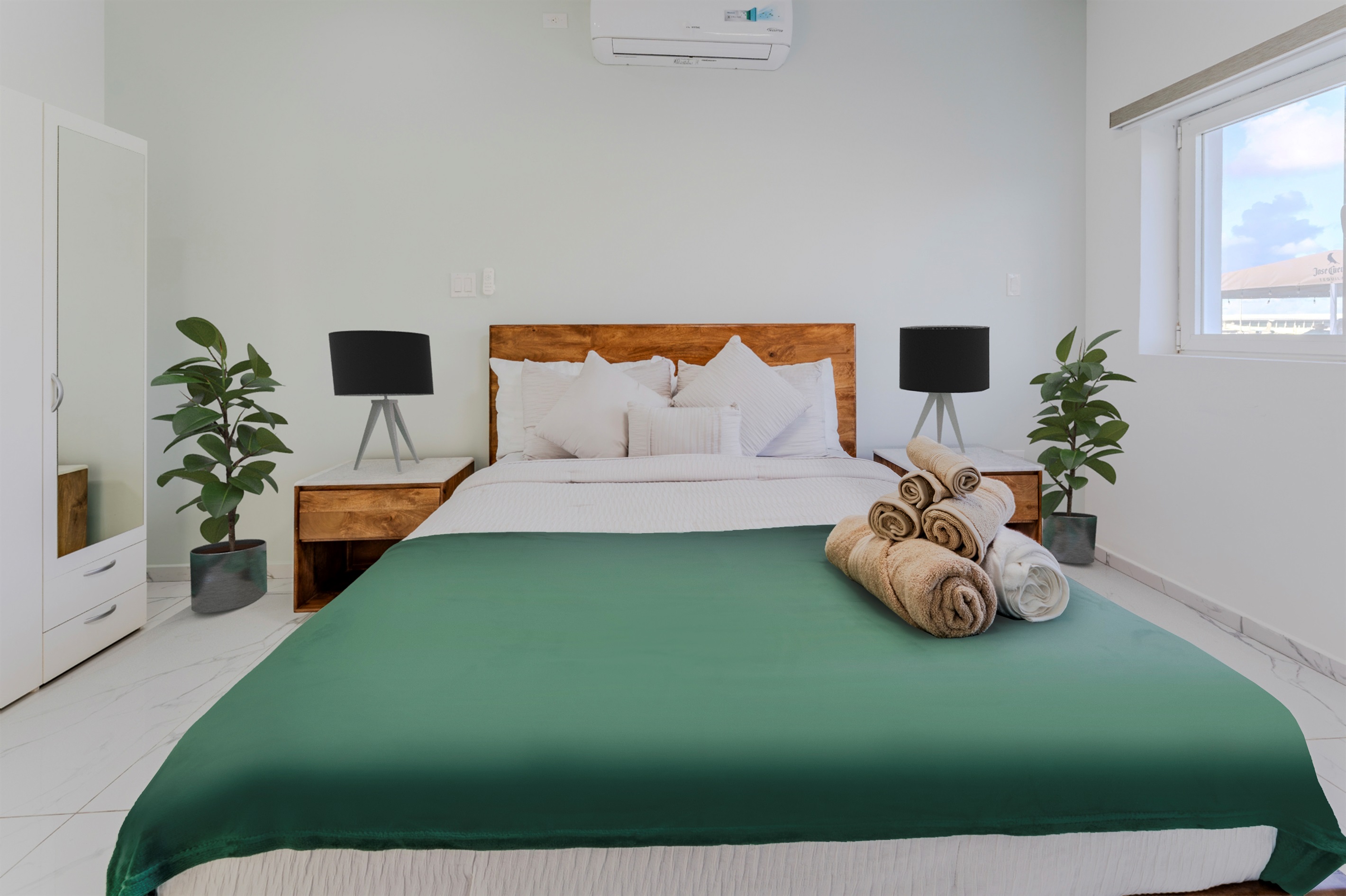 Stylish Bedroom with Green Bedspread & Natural Wood Headboard