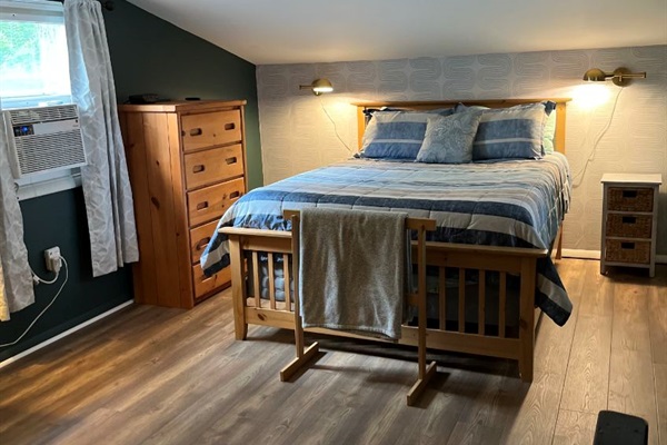 Loft bedroom with a queen bed.