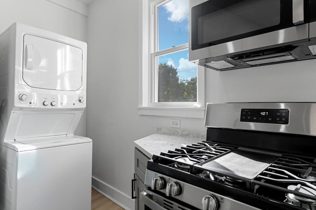 Washer and clothes dryer near the kitchen area