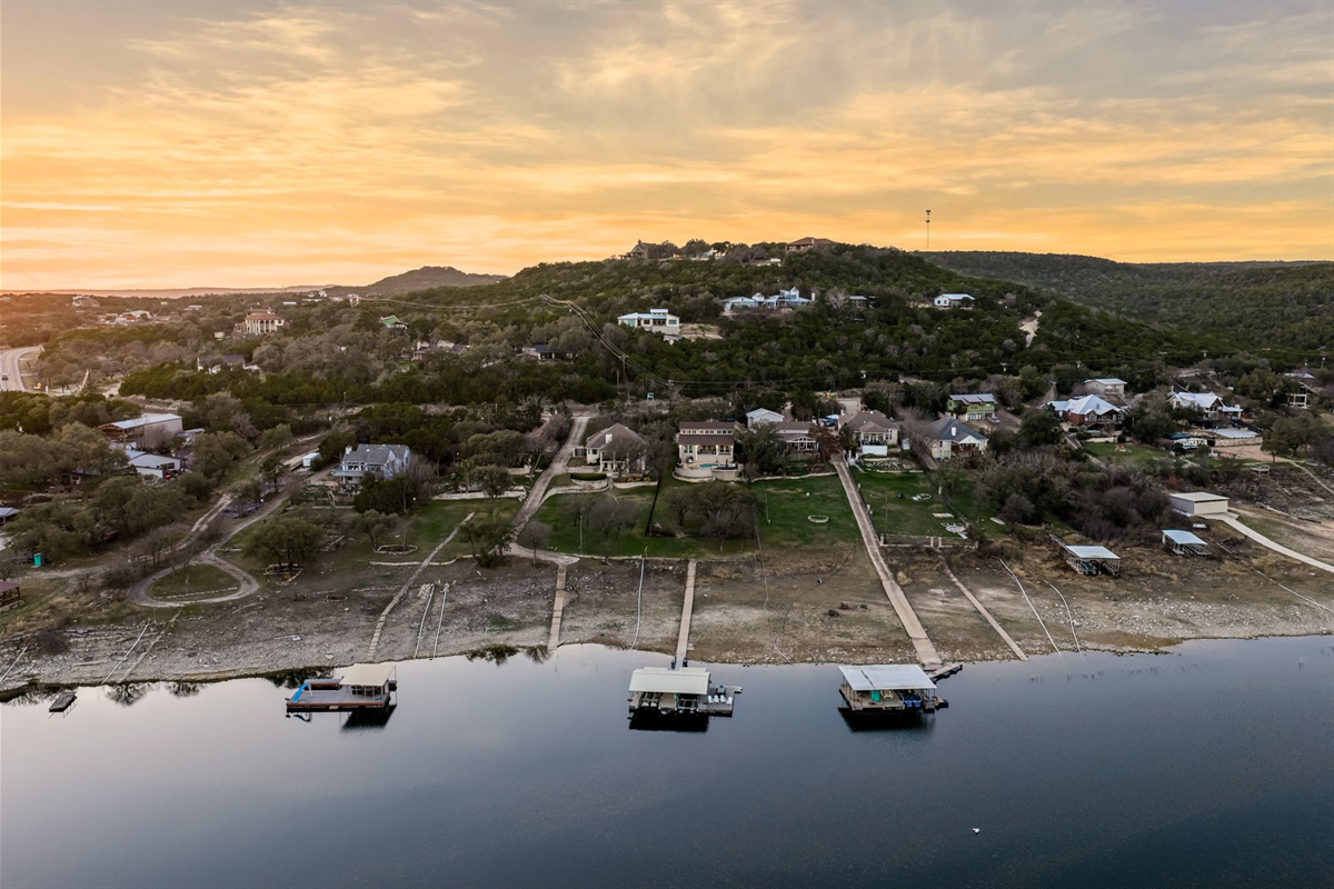 Aerial neighborhood view showcasing the home’s prime lakefront location.