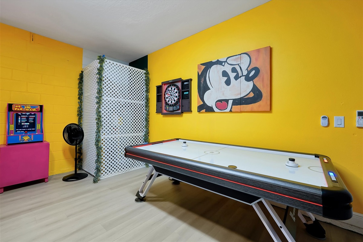 Try your hand a air hockey or darts in the Mickey themed game room.