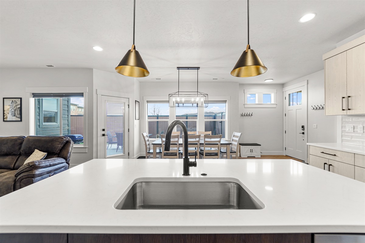 Enjoy cooking in this bright, modern kitchen with beautiful lighting.