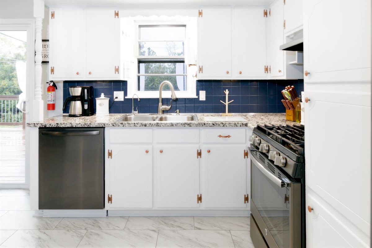 Functional kitchen sink and prep area with ample workspace for meal preparation.