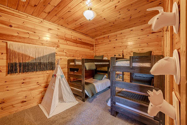 Spacious twin bunk room with lots of space and books so the kids have a space of their own!