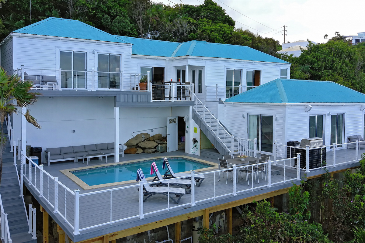 Recently expanded pool deck will have you soaking up the rays all day!  The poolside bedroom entry is directly off the patio.