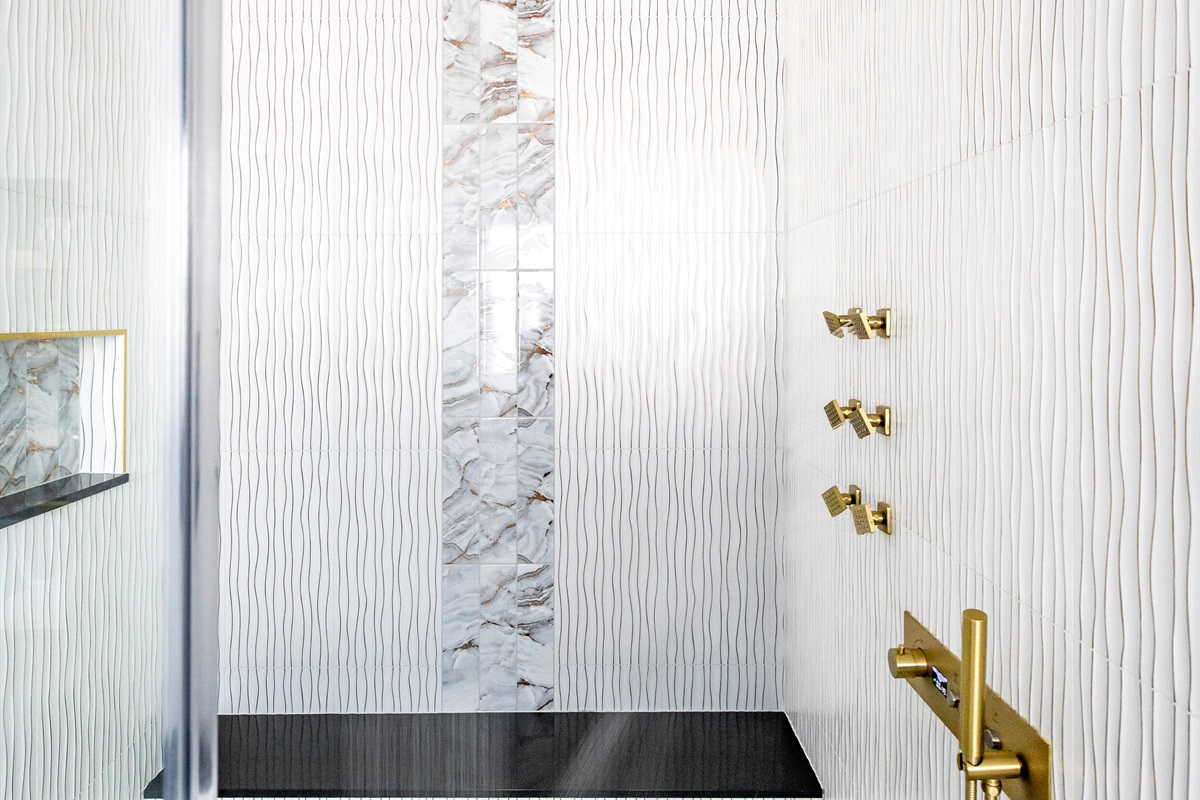 Luxury en-suite bathroom with 2-person air massaging bath, tiled rain shower, and double vanity
