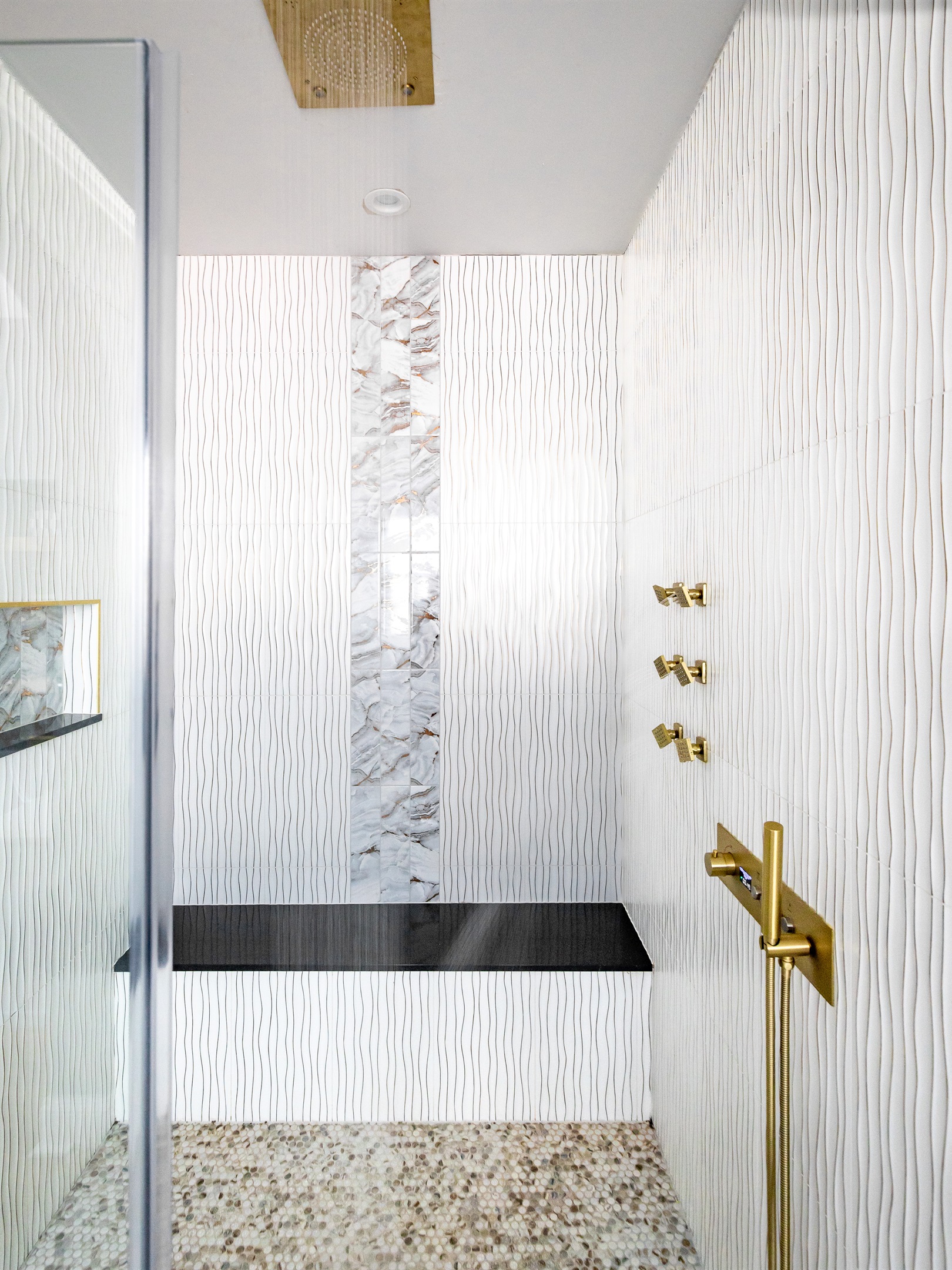 Luxury en-suite bathroom with 2-person air massaging bath, tiled rain shower, and double vanity