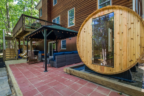 Unwind in our outdoor oasis—lounge seating, gazebo, AND your very own private barrel sauna