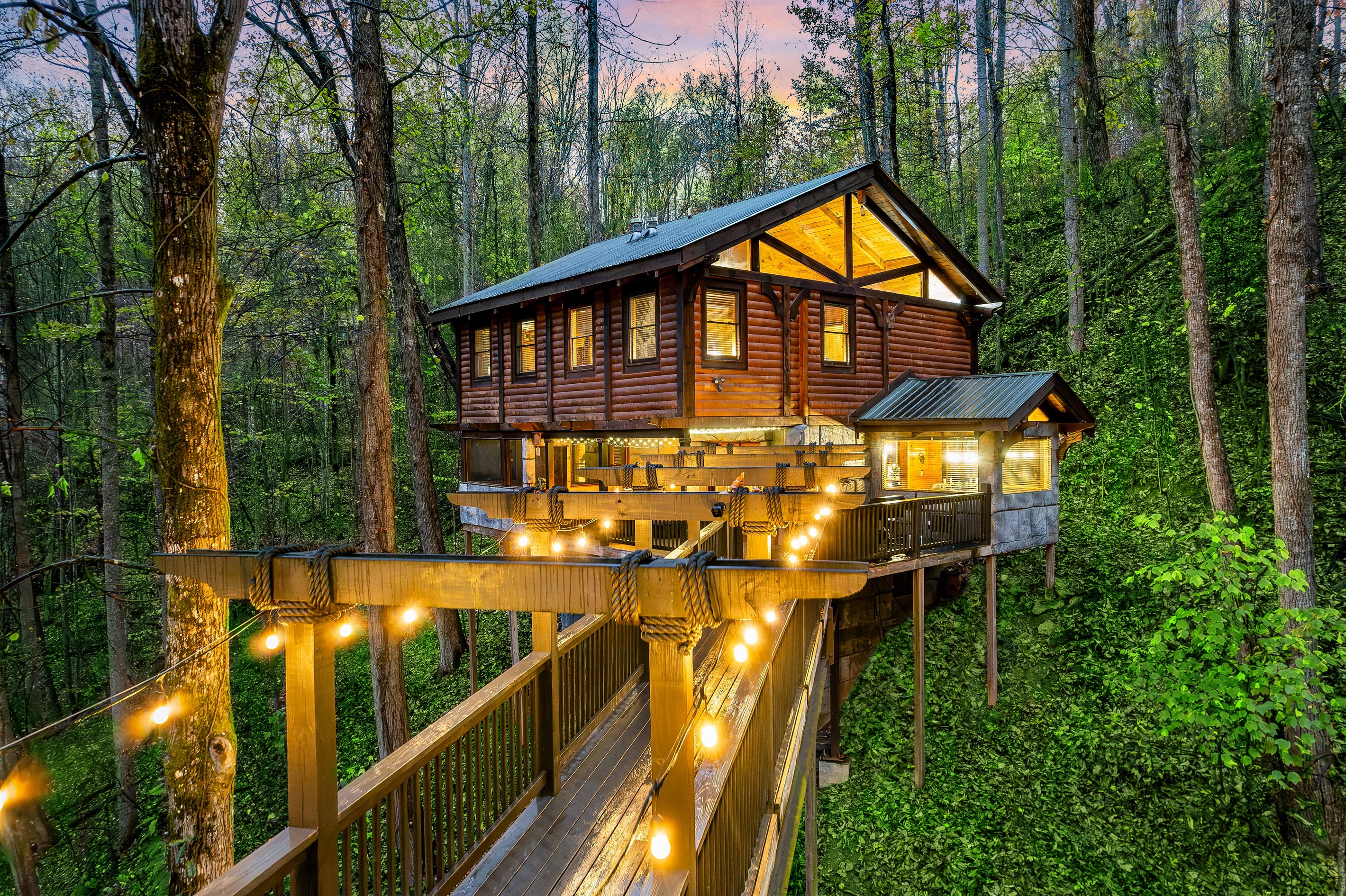 A fairy-tale bridge in an enchanting forest that leads to a beautiful secluded 2 bedroom cabin with King Suites, jacuzzi tubs, and the best vibes.