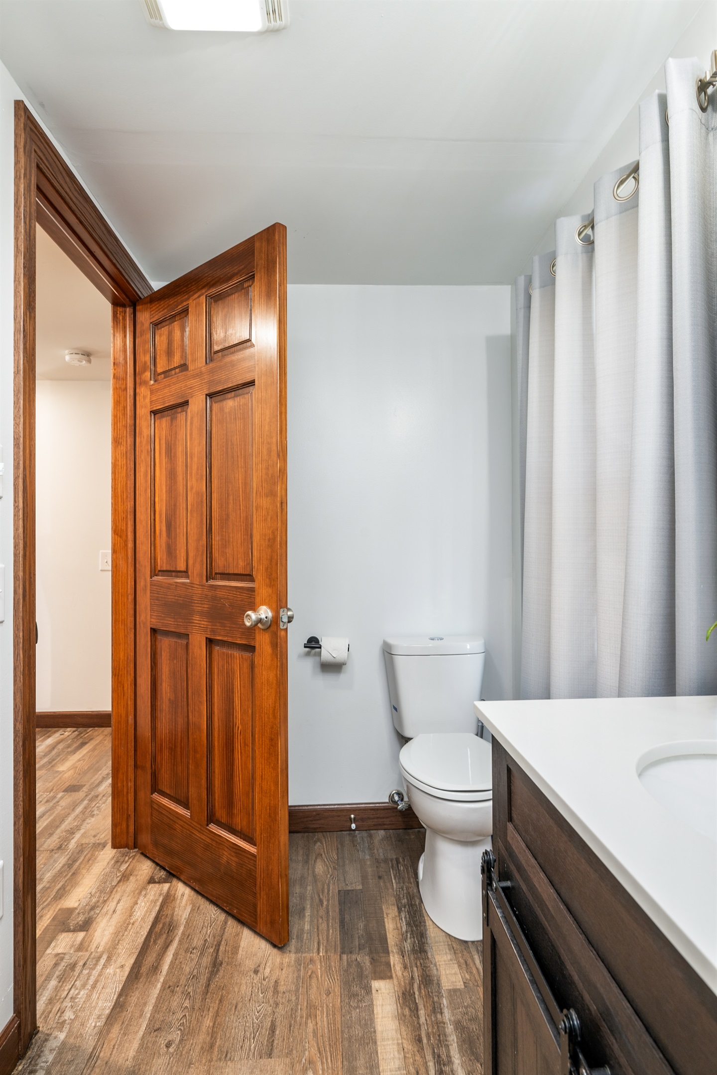 Clean, well-kept bathroom featuring fresh towels, a full vanity, and everything you need to start your day refreshed.
