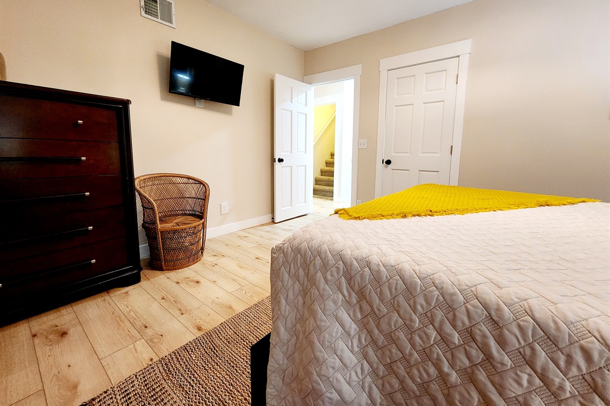 Bedroom #2 with smart tv and a cozy bed.