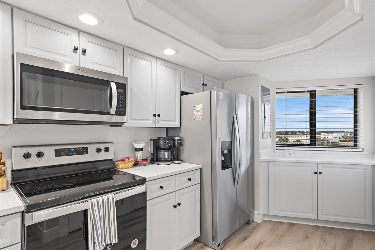 Newly Remodeled and Fully Stocked Kitchen with Quartz Countertops and all new stainless appliances + Gulf Views to enjoy while preparing meals! 