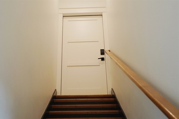 Stairway access leading to the private upstairs apartment.