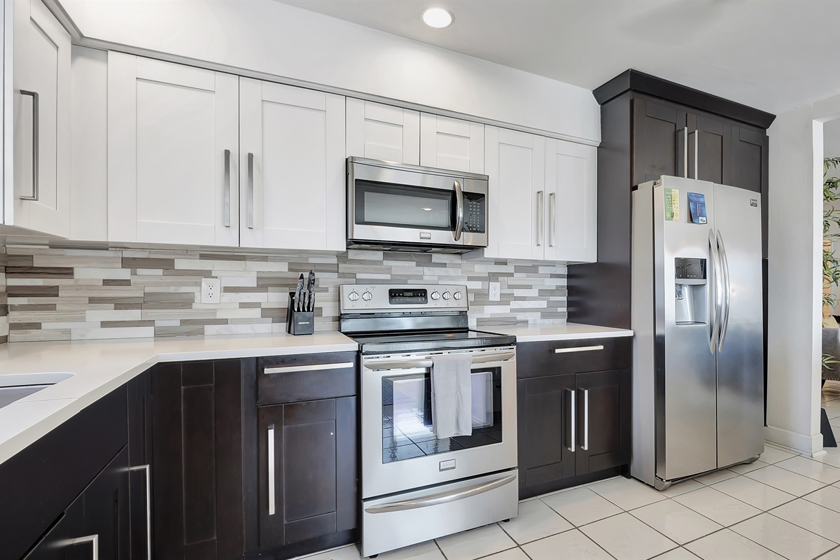 Monochrome, fully-equipped kitchen