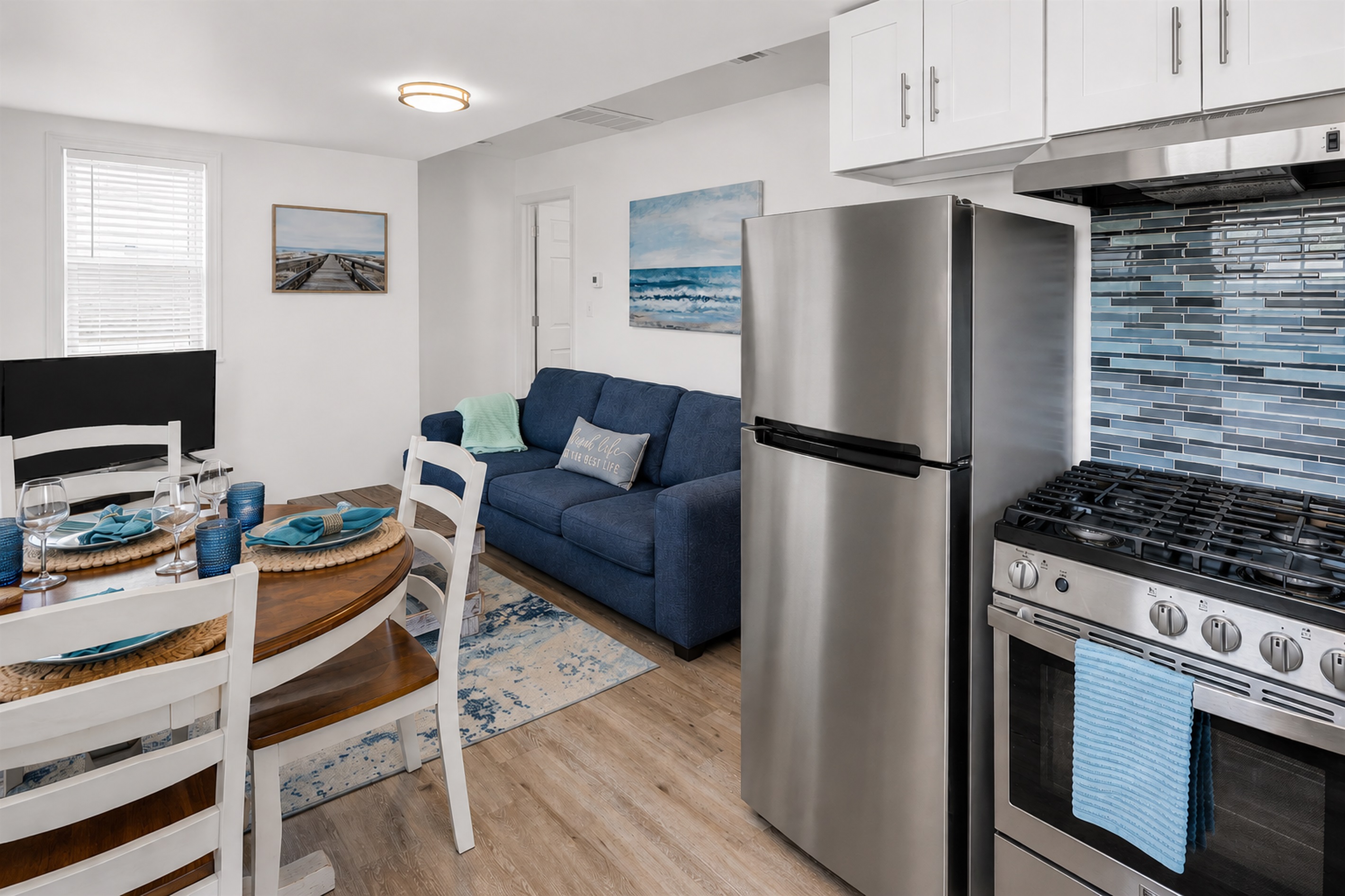 Drop the bags, grab a seat, and pour the first glass of wine. This open kitchen/living/dining room is where you and yours lands the second you walk in.