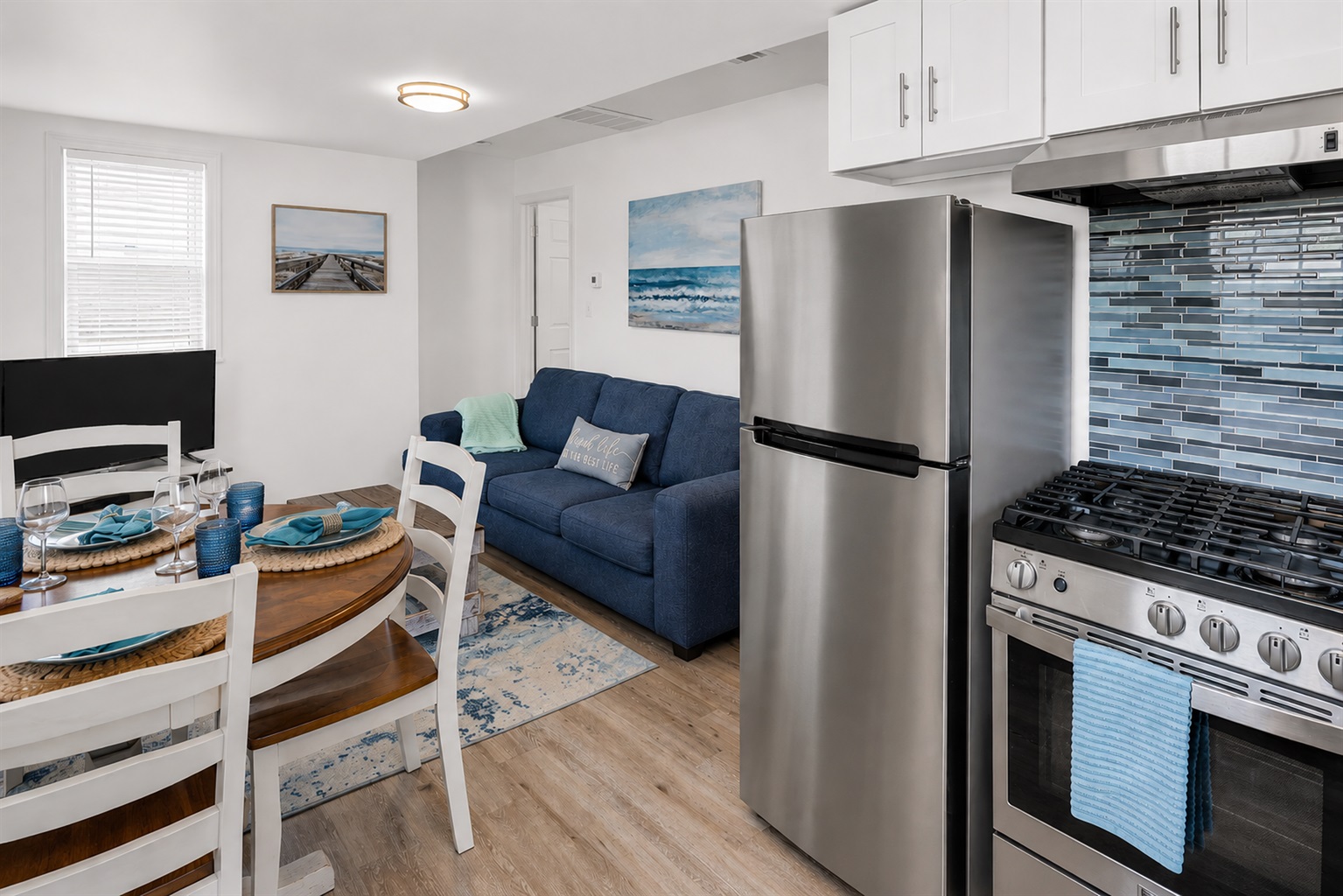 Drop the bags, grab a seat, and pour the first glass of wine. This open kitchen/living/dining room is where you and yours lands the second you walk in.