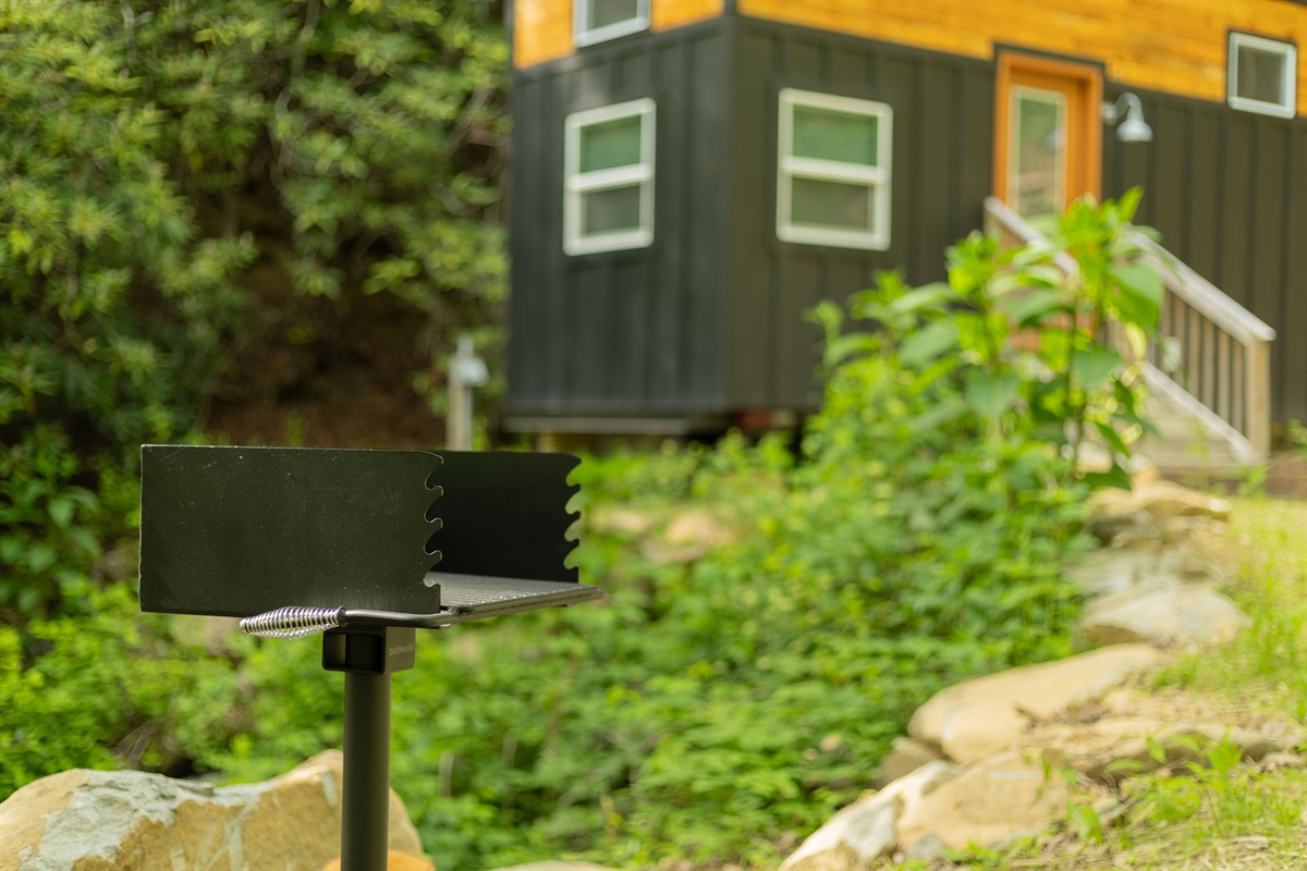 Grill dinner outdoors, then relax back at your cozy woodland retreat.