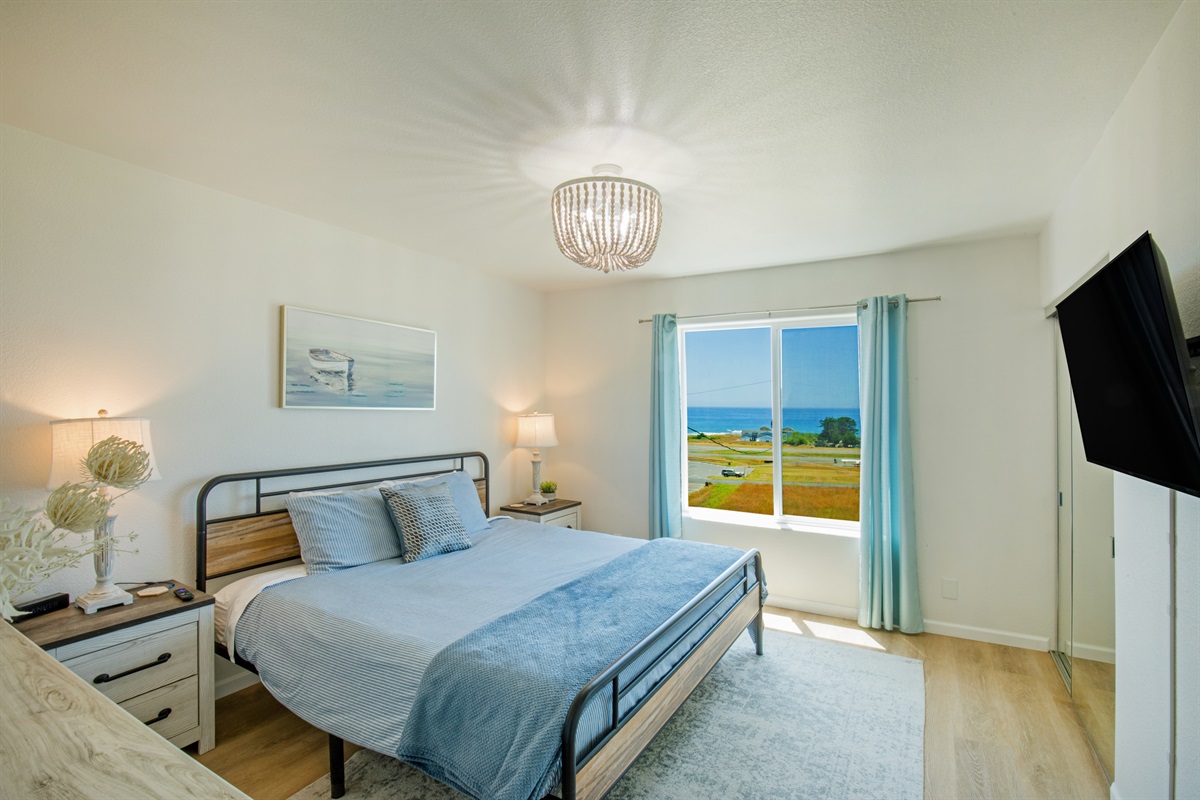 Large bedroom of Unit 1 with king bed. Wake up in the morning to a beautiful view