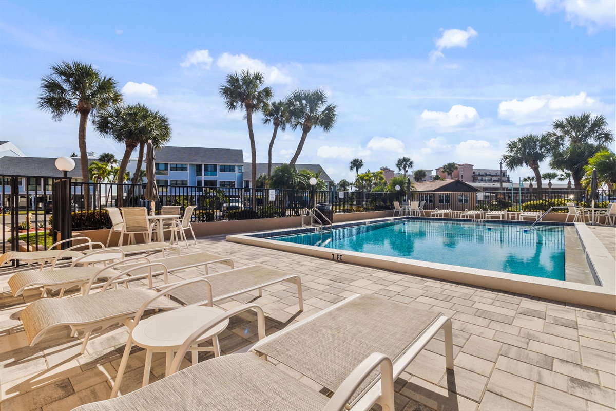 Heated pool is just steps away from the unit.