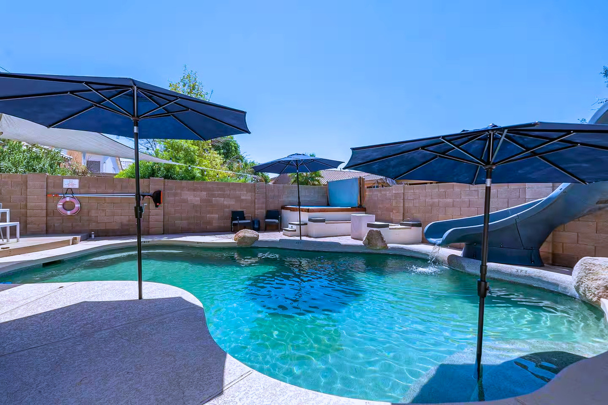Wonderful pool with a slide!  Great for fun or basking in the sun.
