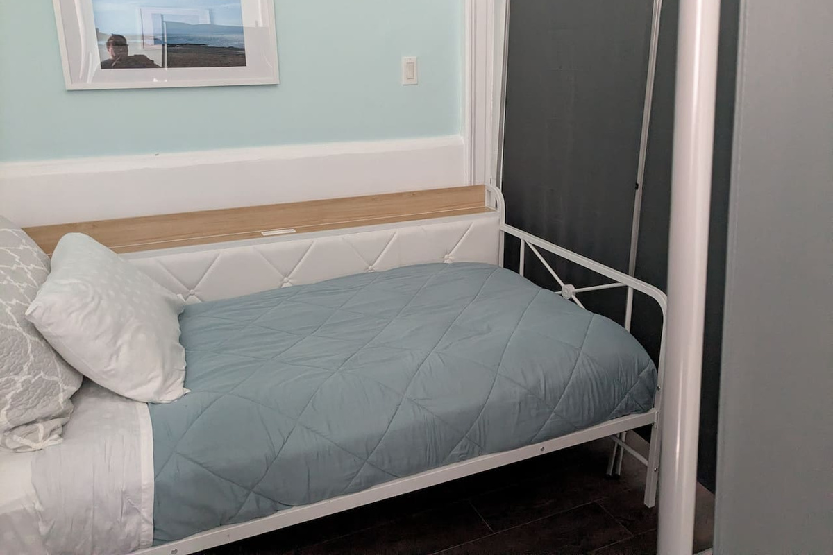 twin bed with privacy screen