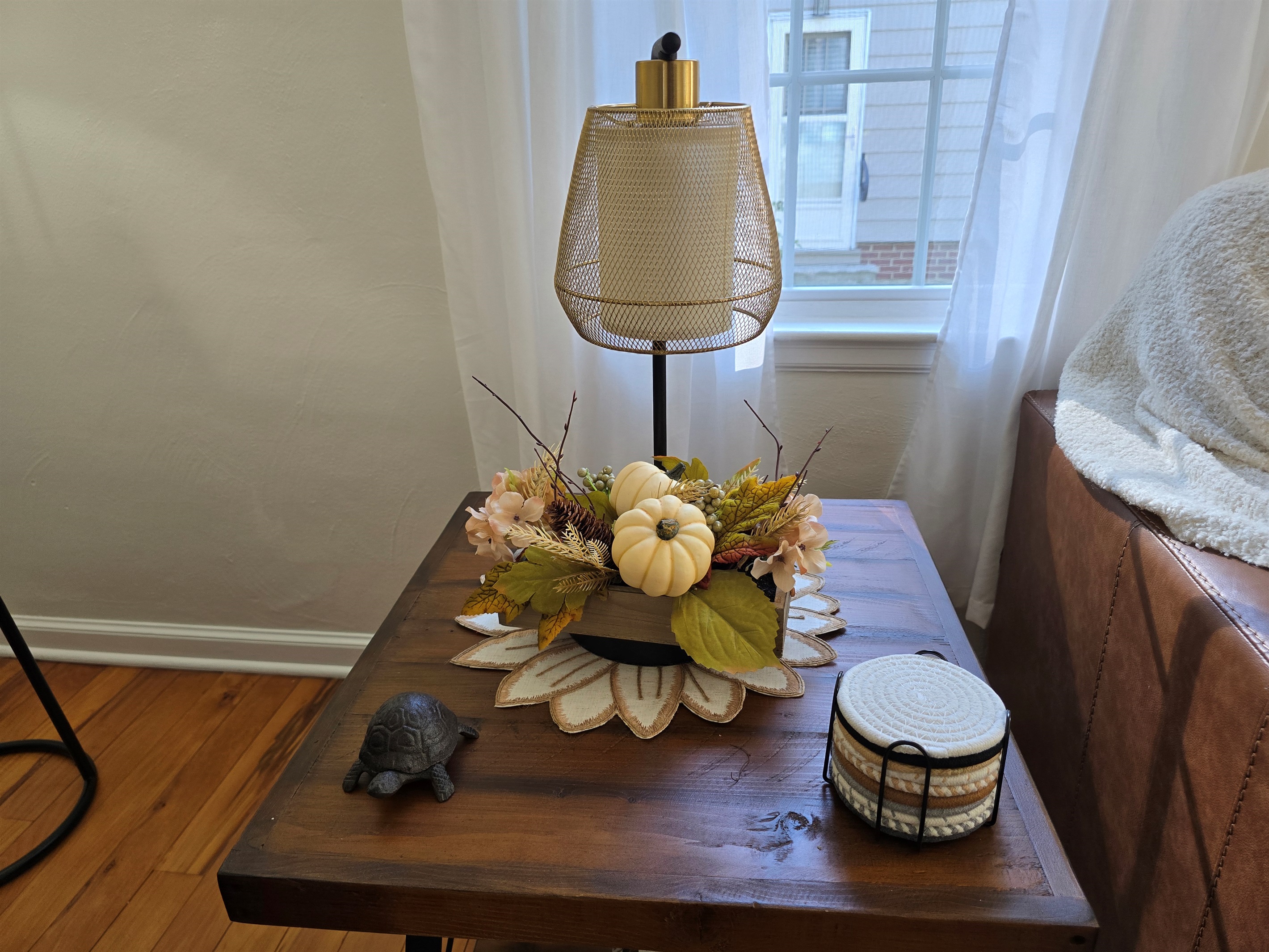 Pumpkin spice vibes, anyone? Our side tables are dressed for fall with cozy decor, plenty of coasters, and mood-setting lamps that double as phone chargers—because ambiance and convenience go hand in hand.