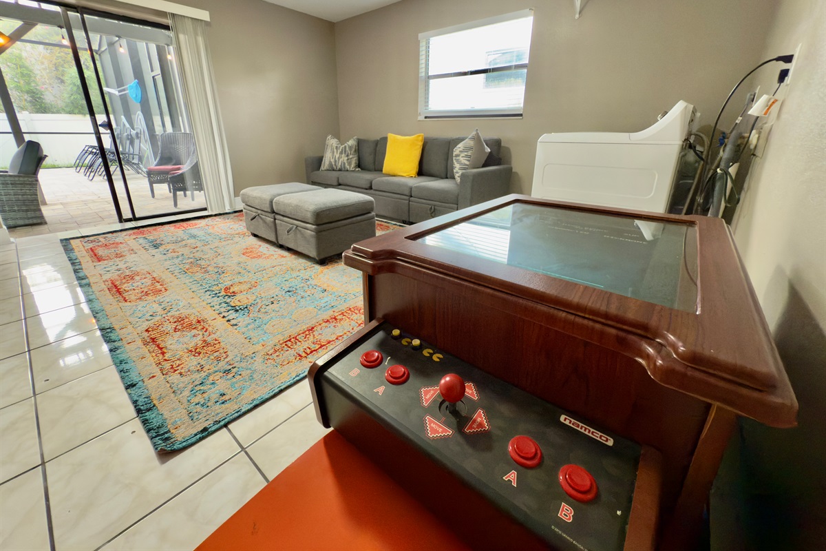 A striking vintage-style area rug in rich turquoise and burnt orange tones grounds the space and gives it a warm, inviting energy.
