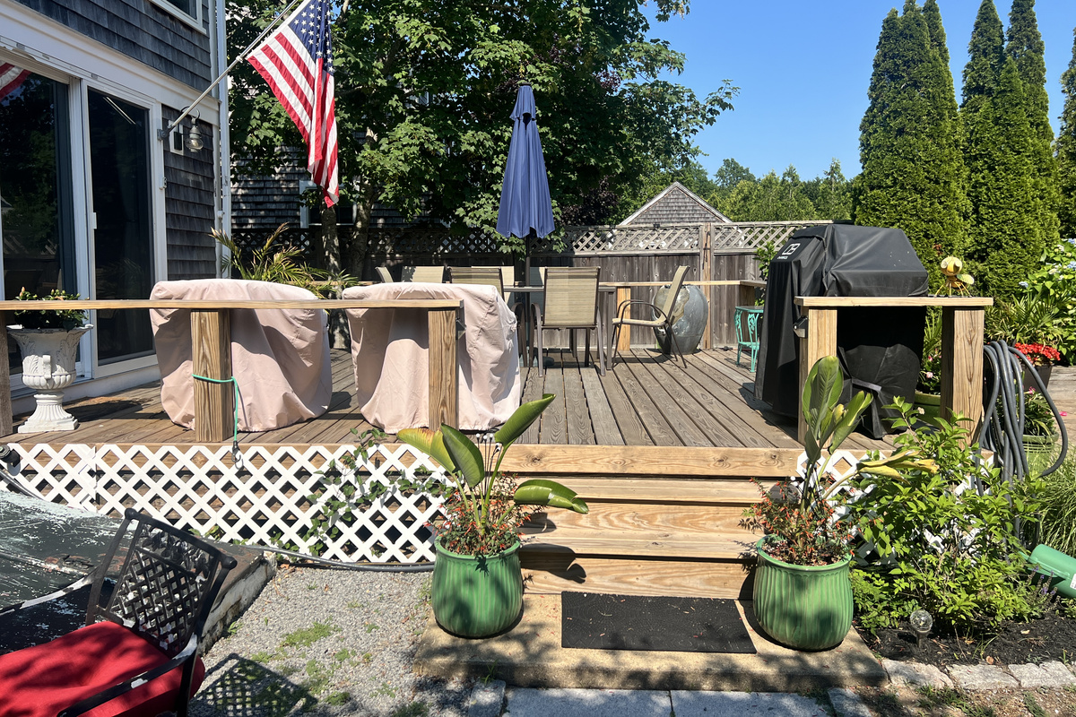 Deck with barbecue grill for outdoor cooking