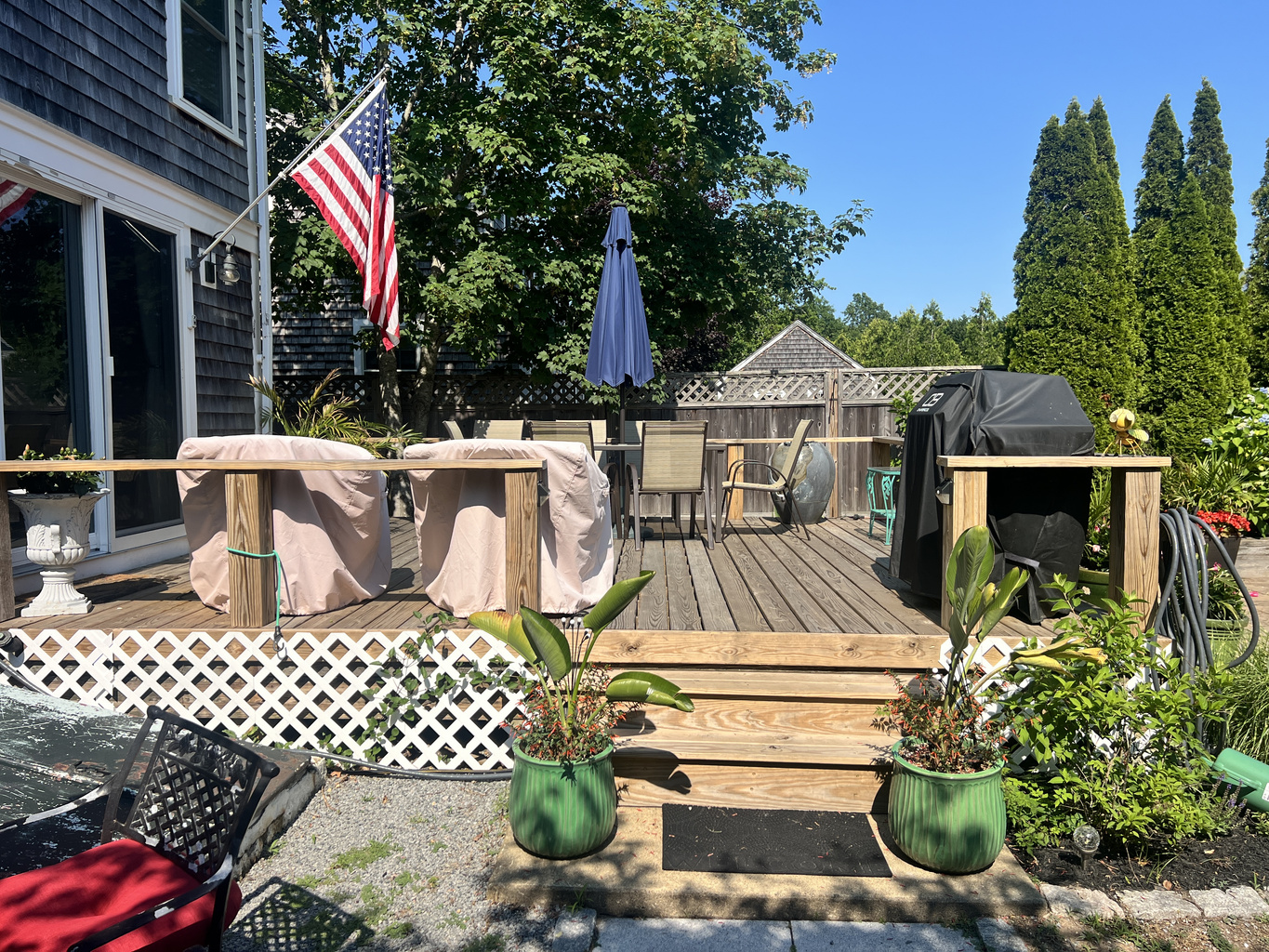 Deck with barbecue grill for outdoor cooking