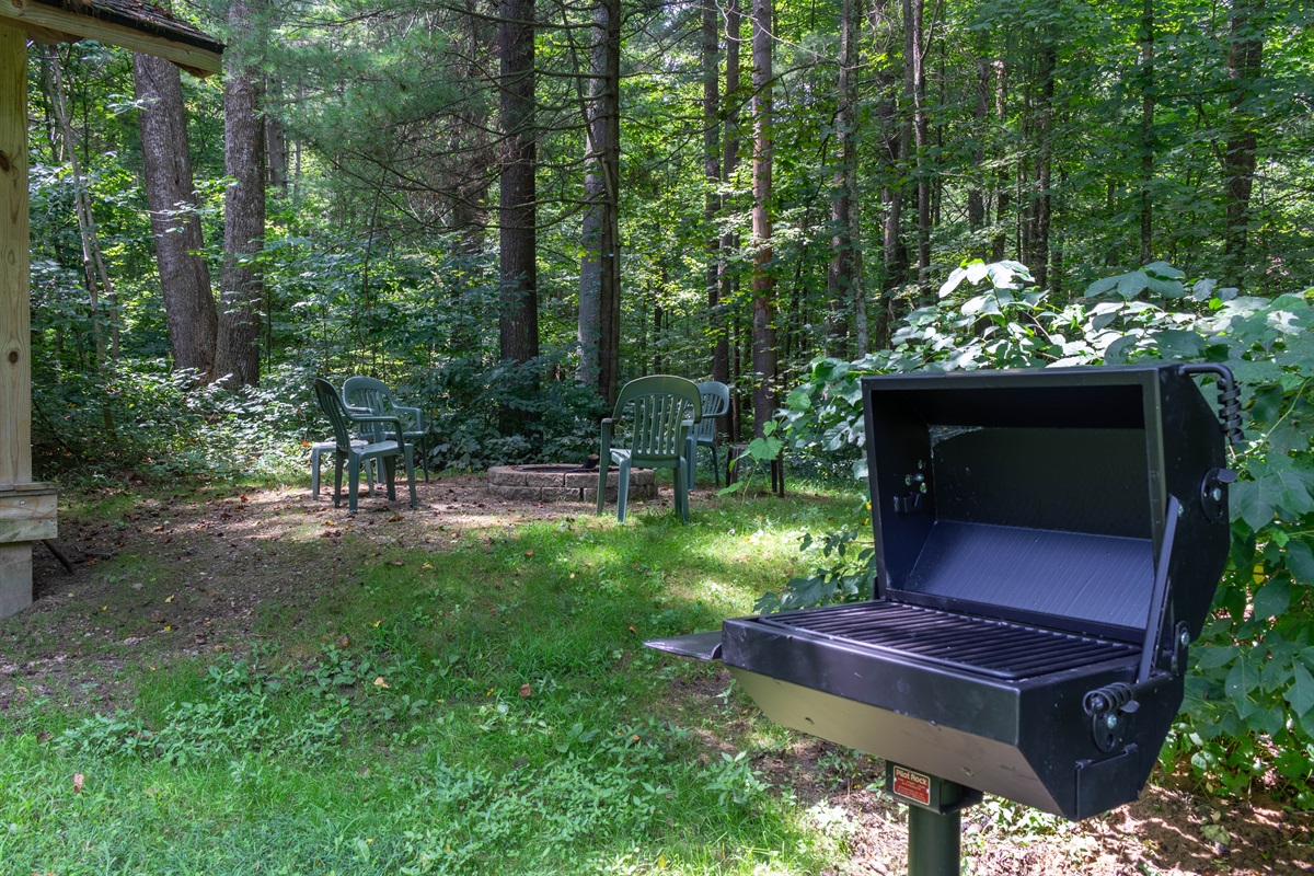 The charcoal grill is located off the rear deck