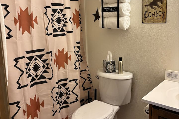 Full bathroom off Primary Bedroom with tub and shower.  Shampoo, conditioner and body wash provided