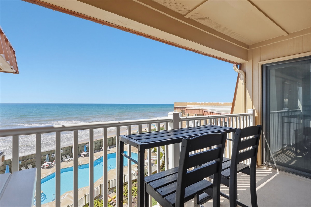Private balcony overlooking the beach and community pool