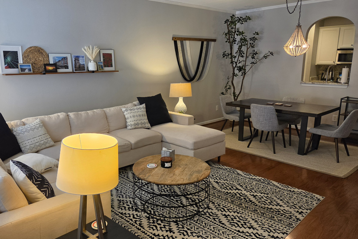 Living room with fireplace and dining area