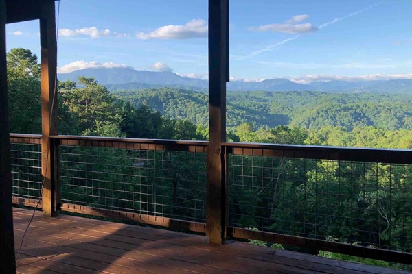 The lower level 3 sided deck has immense views of the Smokies.