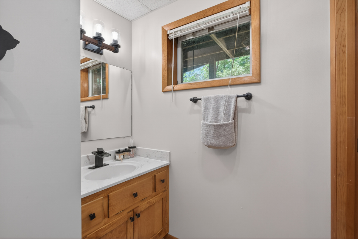 Bathroom: Modern elegance with a touch of nature, featuring stylish fixtures and serene views!