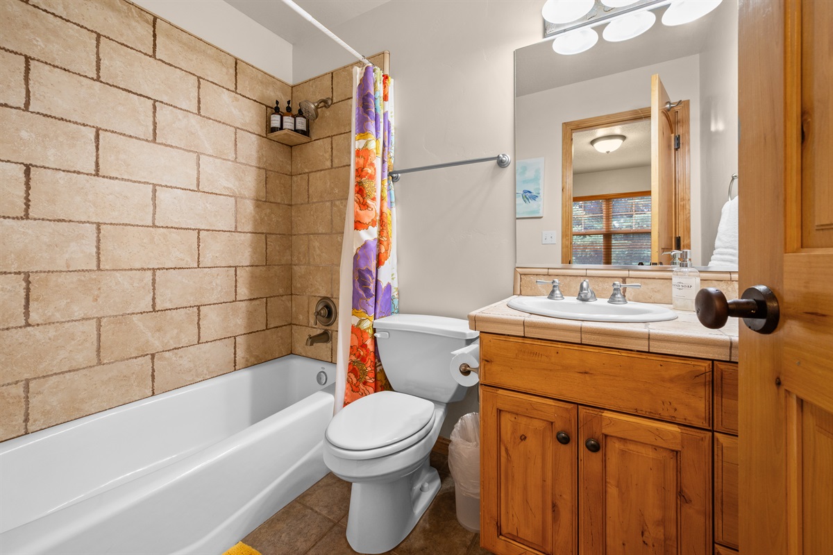 Freshen up after a day of adventure in a clean, modern bathroom. This bathroom is the ensuite for bedroom 2, Upstairs