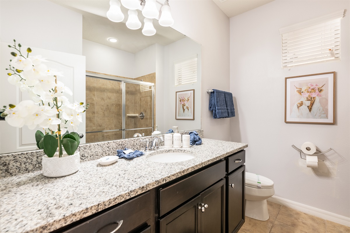 En-Suite 2 for Master Suite 2 has a shower, sink and toilet