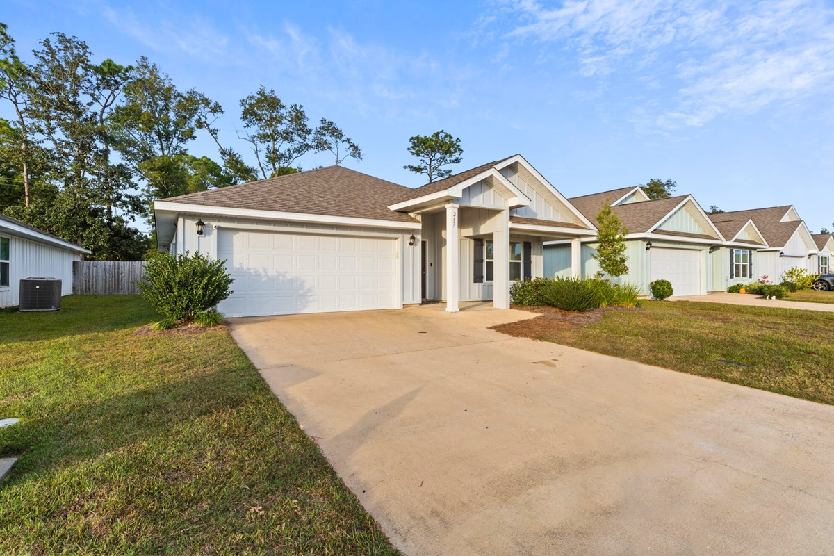 Easy driveway access makes coming and going simple, whether you’re heading to the beach, shopping, or dinner nearby.