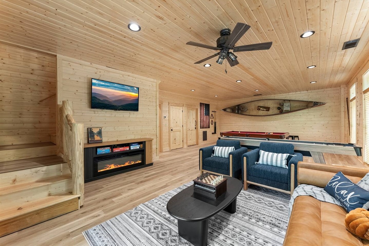 Cozy Game Room with Fireplace & Nautical Charm
