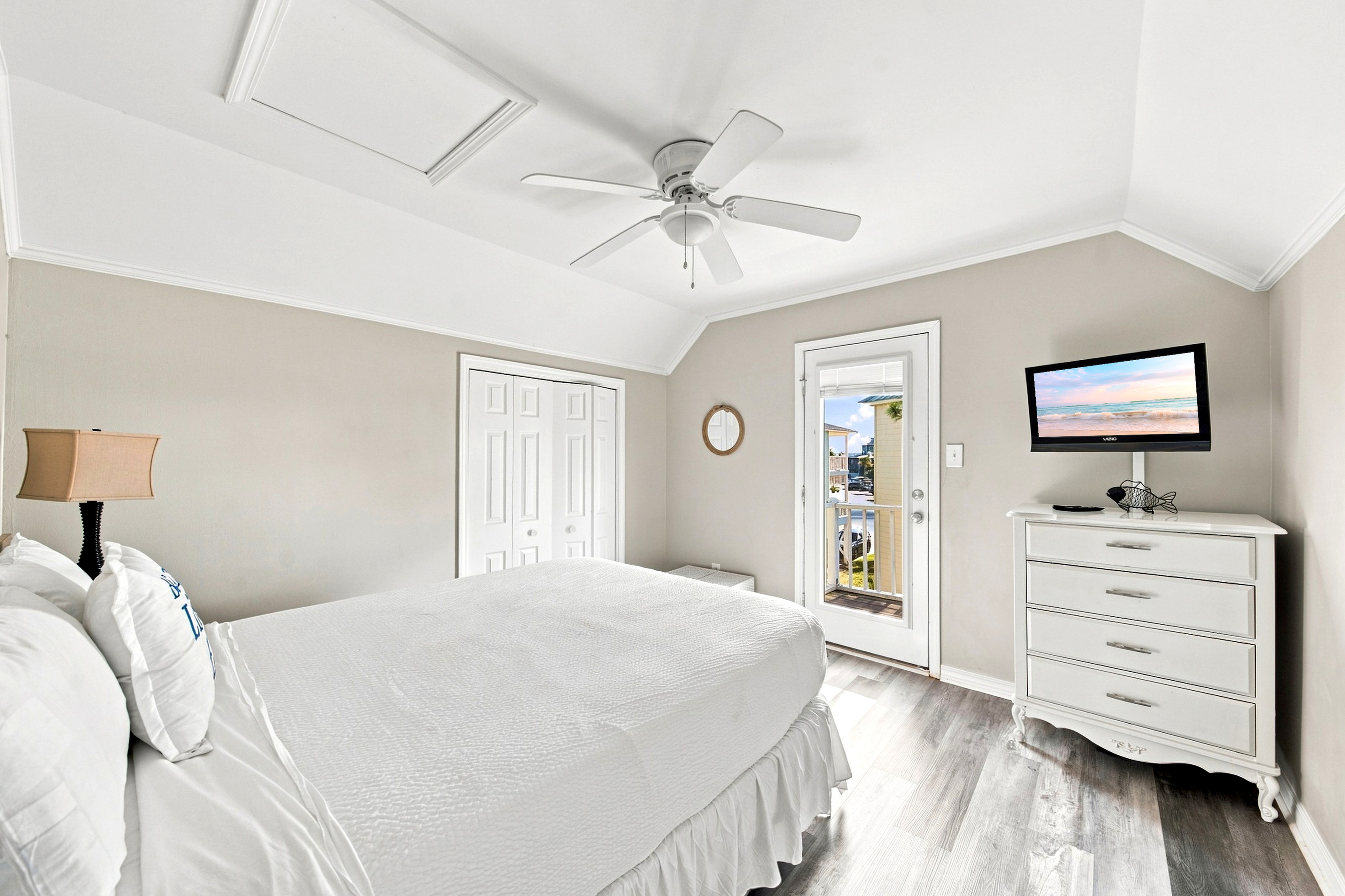 The main-level primary suite offers a king bed and Smart TV for a private, comfortable retreat after a full day exploring the coast.
