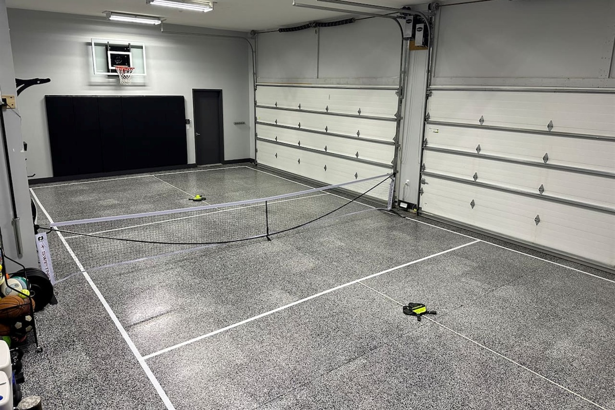 Pickle ball court inside the garage with quick setup swiftnet pickleball net