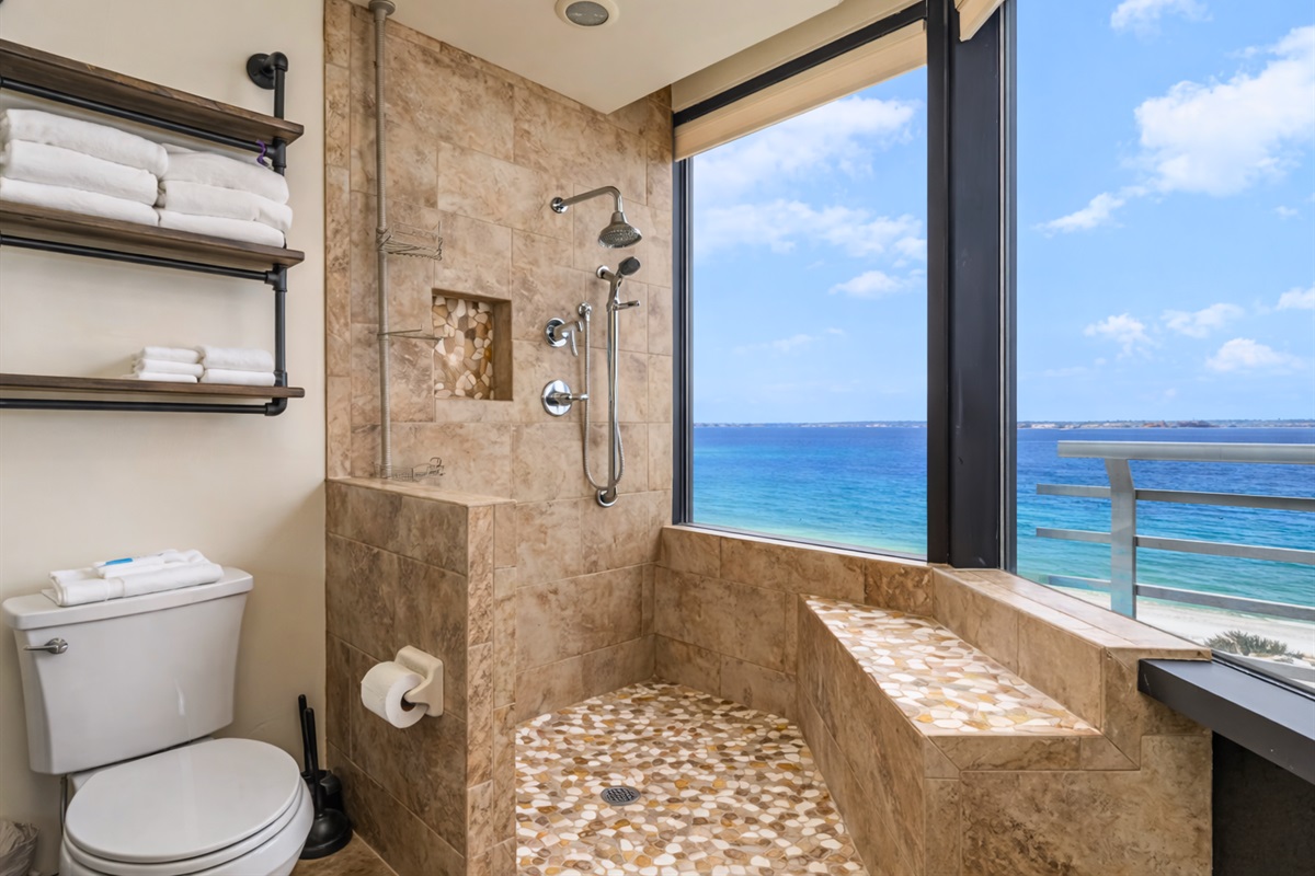 Enjoy a beautifully tiled shower with a view that makes even routine moments feel special.